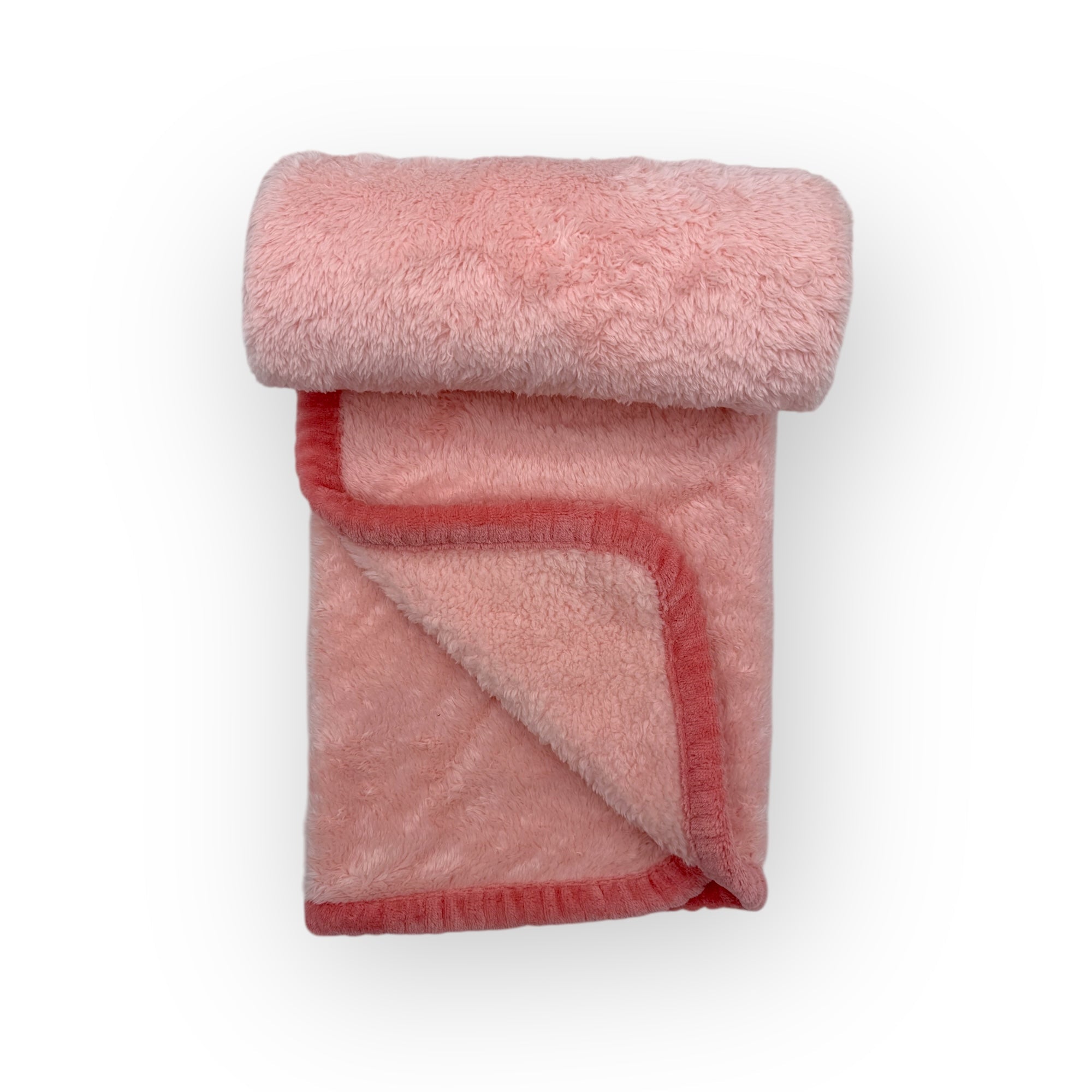Folded pink fleece blanket on a white background