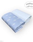 Folded blue blanket with white leaf pattern on a white background, branded 'Mother's Choice'.