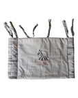 Crib bumper with zebra design on a white background