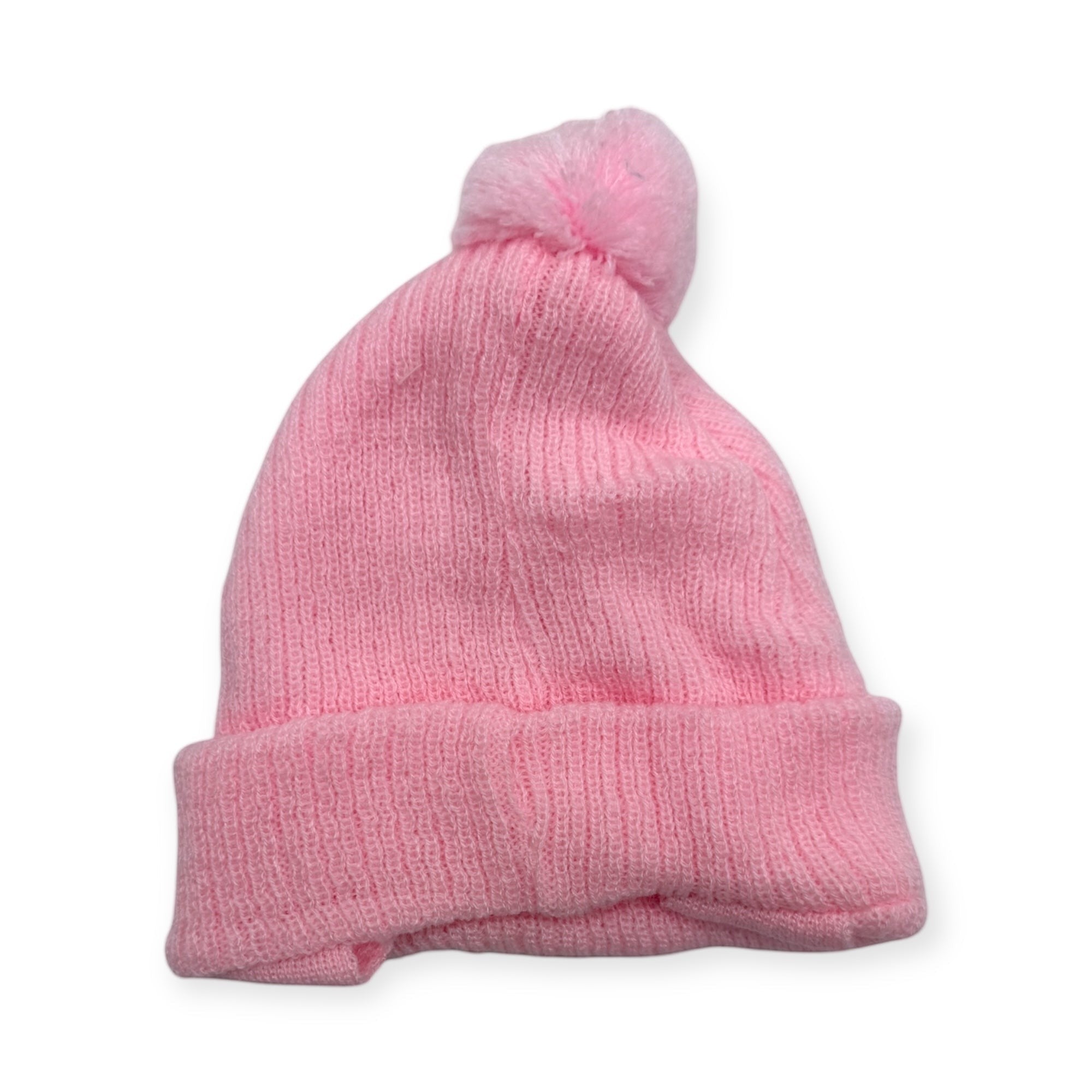 Pink knit beanie with a pom-pom on a white background