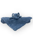 Blue textured blanket with a matching plush toy on a white background