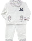 White baby outfit with patterned collar and cuffs on a white background