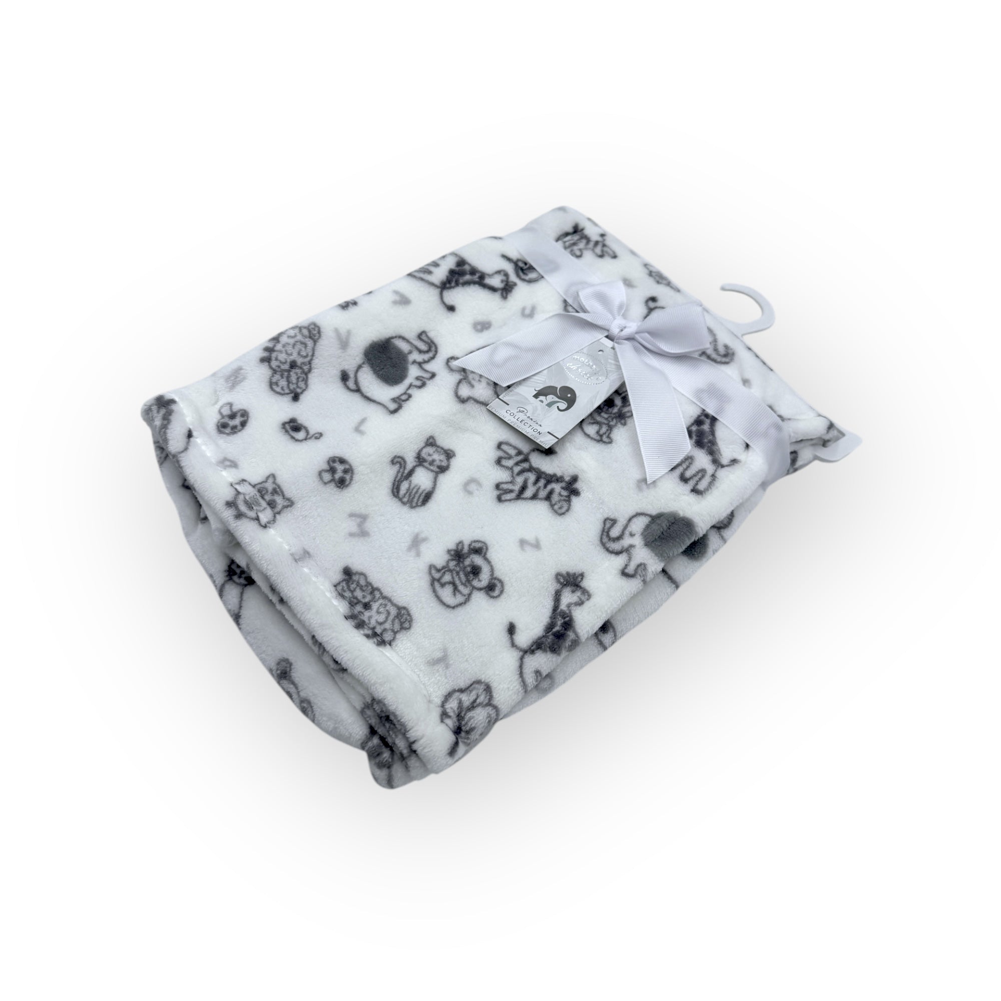 White blanket with black animal prints and a white tag on a white background