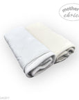 Folded gray and white blanket with 'Mother's Choice' branding on a white background