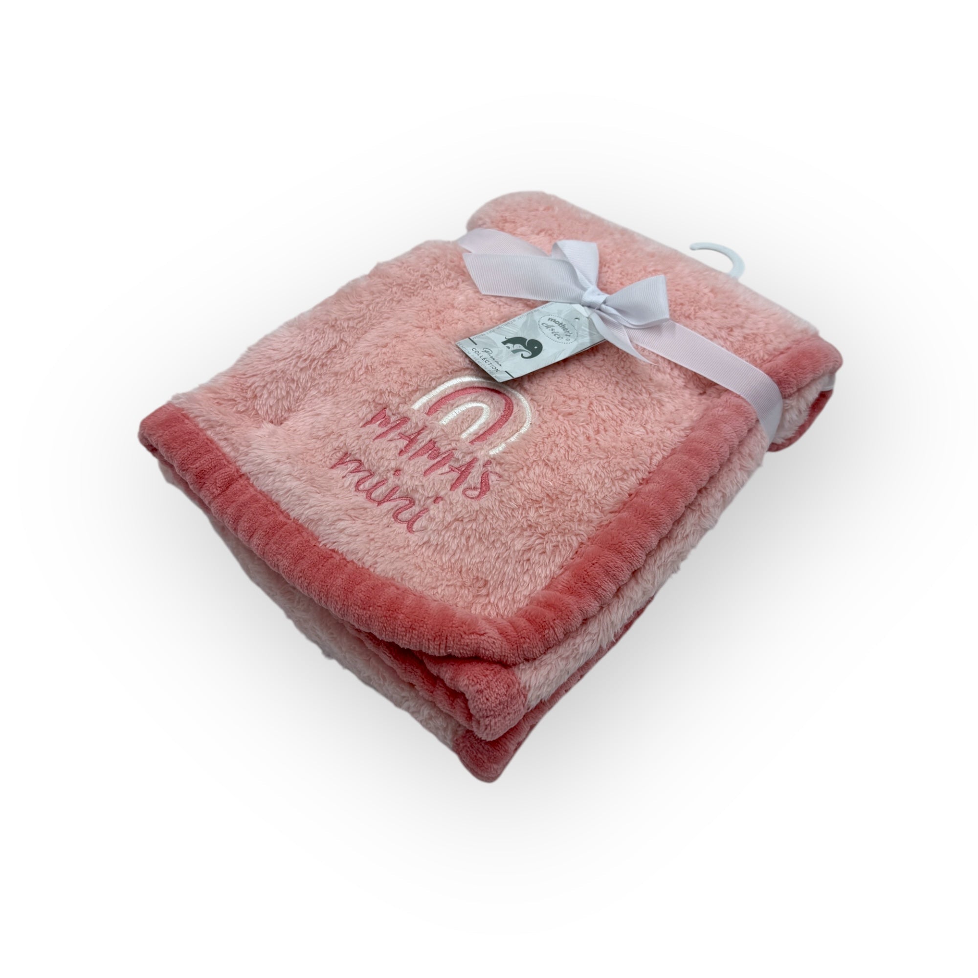 Pink plush blanket with 'Mama's girl' text and a tag on a white background