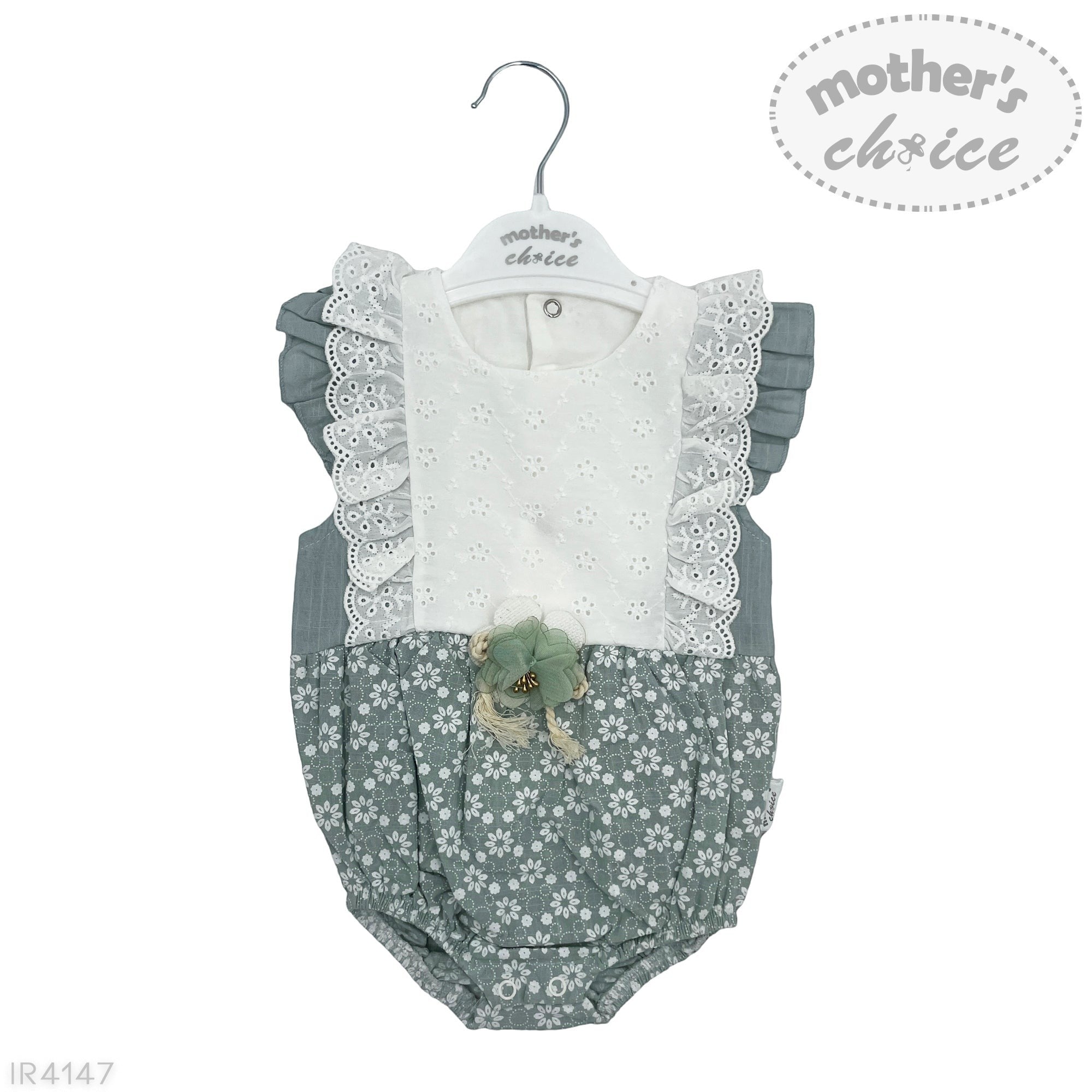 Baby romper with lace details on a hanger, branded 'mother's choice'.