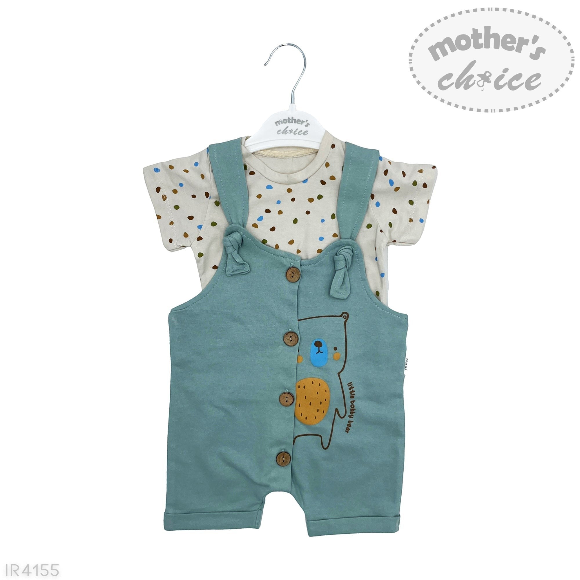 Children's outfit with green overalls and polka dot shirt on a white background