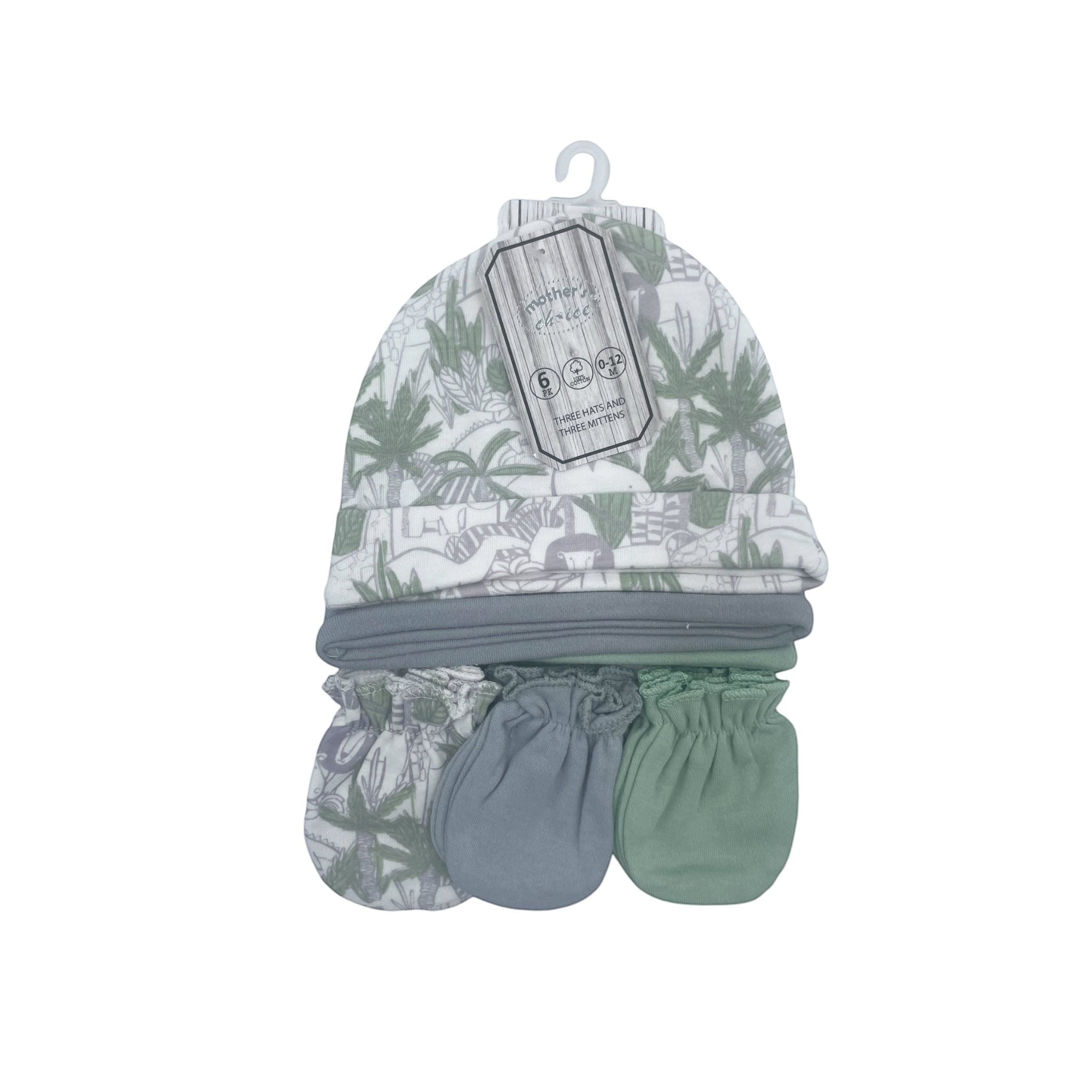 Baby hat, bib, and mittens set with leaf pattern on a white background