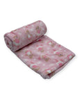 Pink blanket with teddy bear pattern on a white background