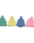 Four colorful beanies (green, yellow, blue, pink) on a white background