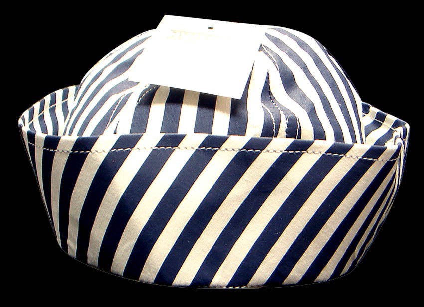Navy and white striped fabric basket on a black background