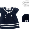 Navy blue dress with white trim and matching hat on a white background, featuring 'mother's choice' branding.