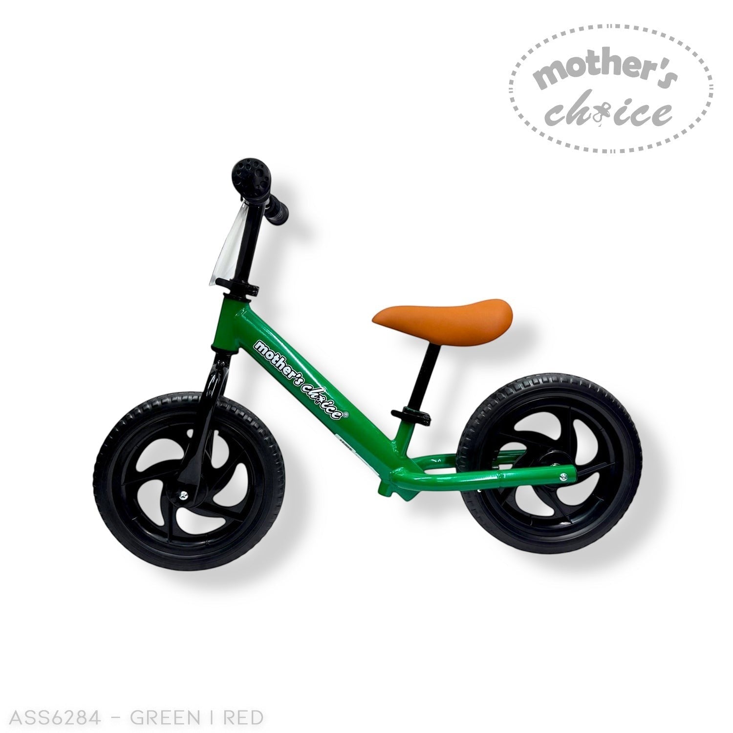 Green balance bike with brown seat on a white background, branded 'Mother's Choice'.