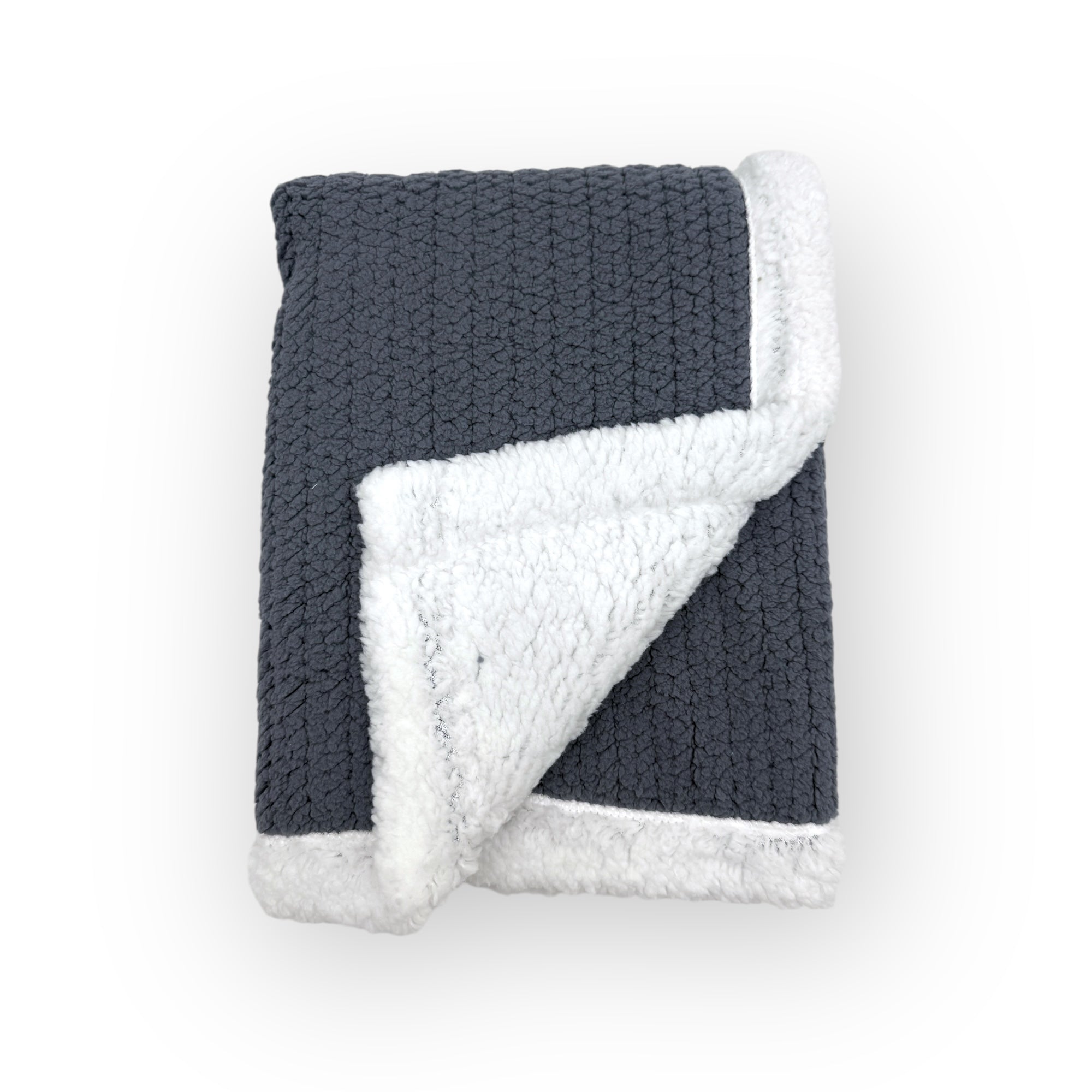 Knitted blanket with dark gray exterior and white interior on a white background