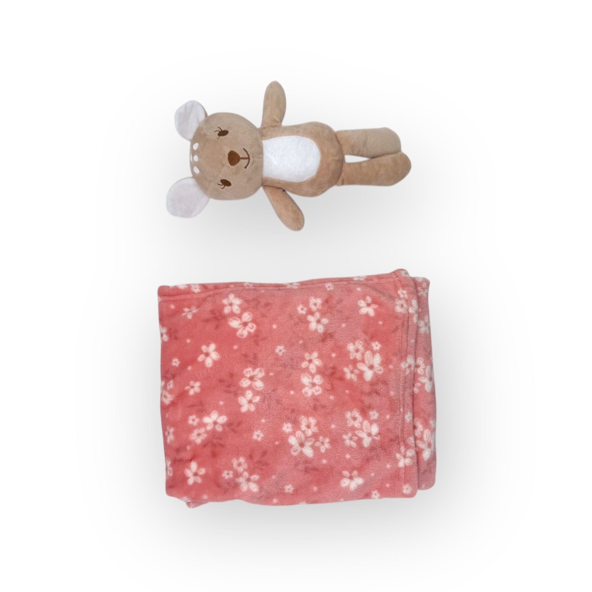 Floral-patterned pink blanket with a small plush toy on a white background