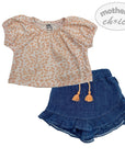 Children's outfit with floral top and denim skirt on a white background, featuring 'mother's choice' branding.