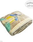 Folded blanket with cartoon character design on a white background, featuring 'Mother's Choice' branding.
