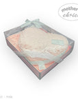 Pink baby bootie in a box with 'Mother's Choice' branding on a white background