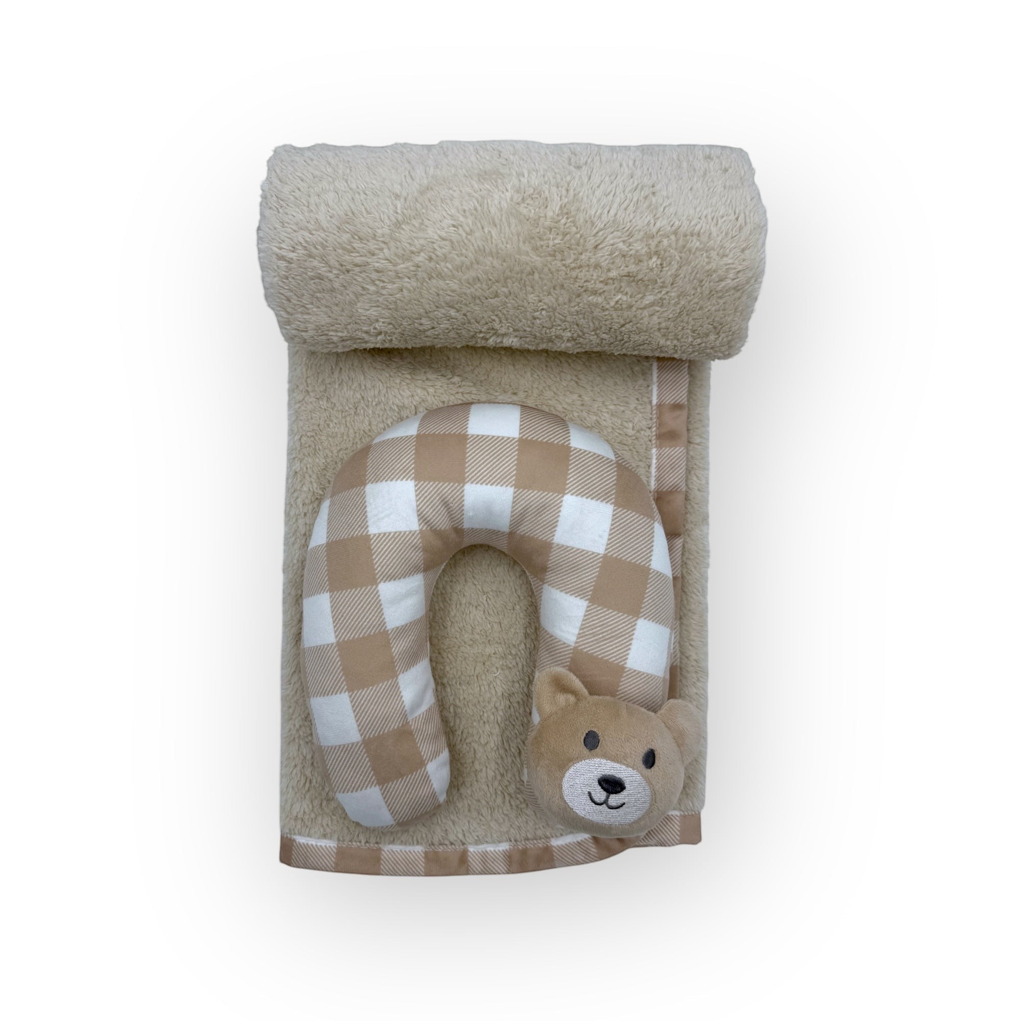 Baby neck pillow with checkered pattern and teddy bear face design, rolled up towel on a white background