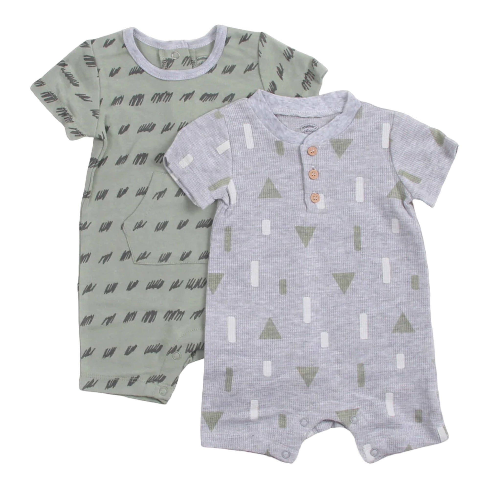 Two baby rompers with geometric patterns on a white background