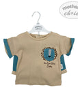 Beige t-shirt with lion design on a hanger, featuring 'mother's choice' branding.