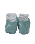 Pair of teal baby booties with gray cuffs on a white background