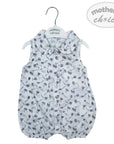 Baby romper with floral pattern on a hanger with 'mother's choice' label.