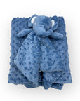 Blue textured blanket with a soft toy elephant on a white background