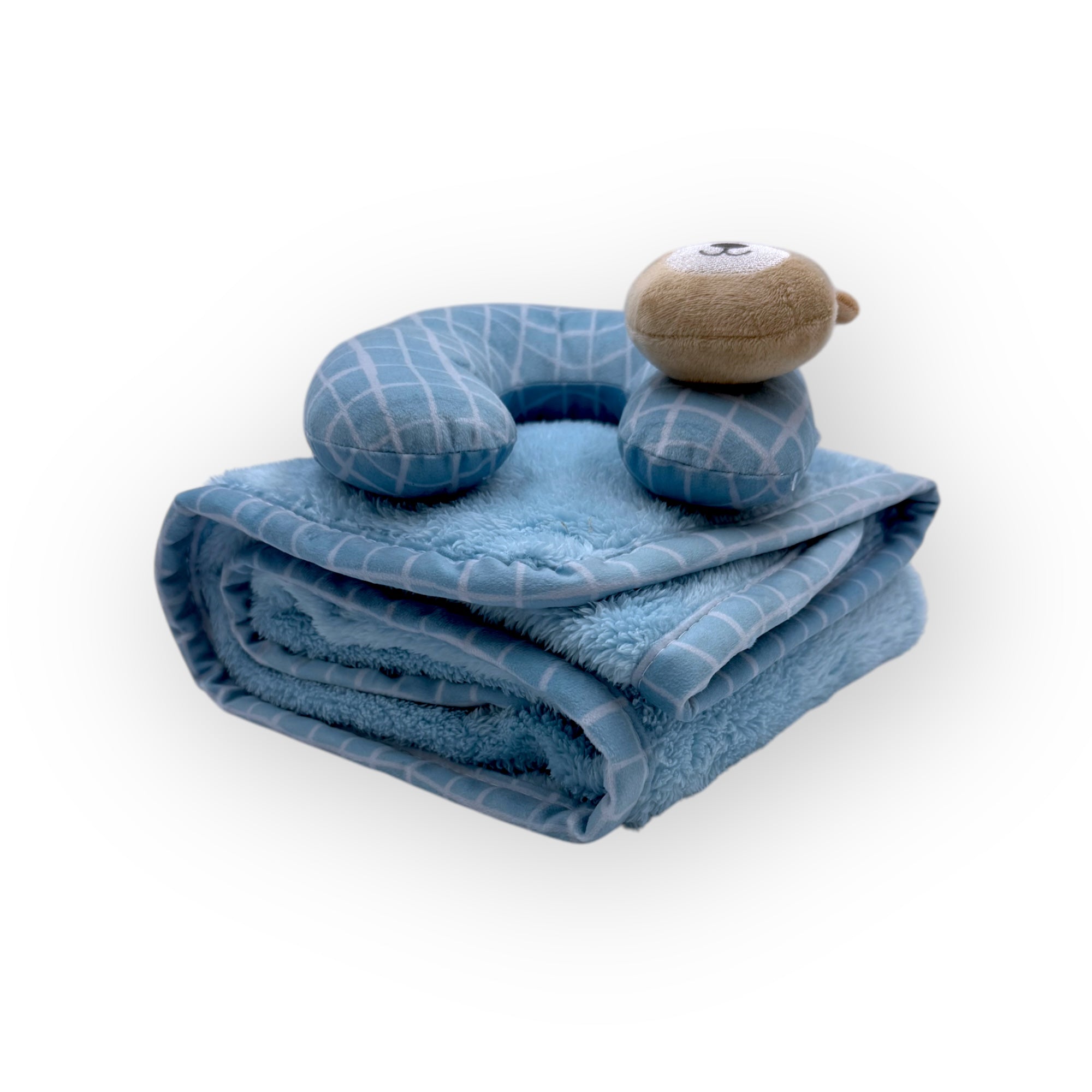Blue baby blanket with pillow and toy on a white background