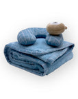 Blue baby blanket with pillow and toy on a white background