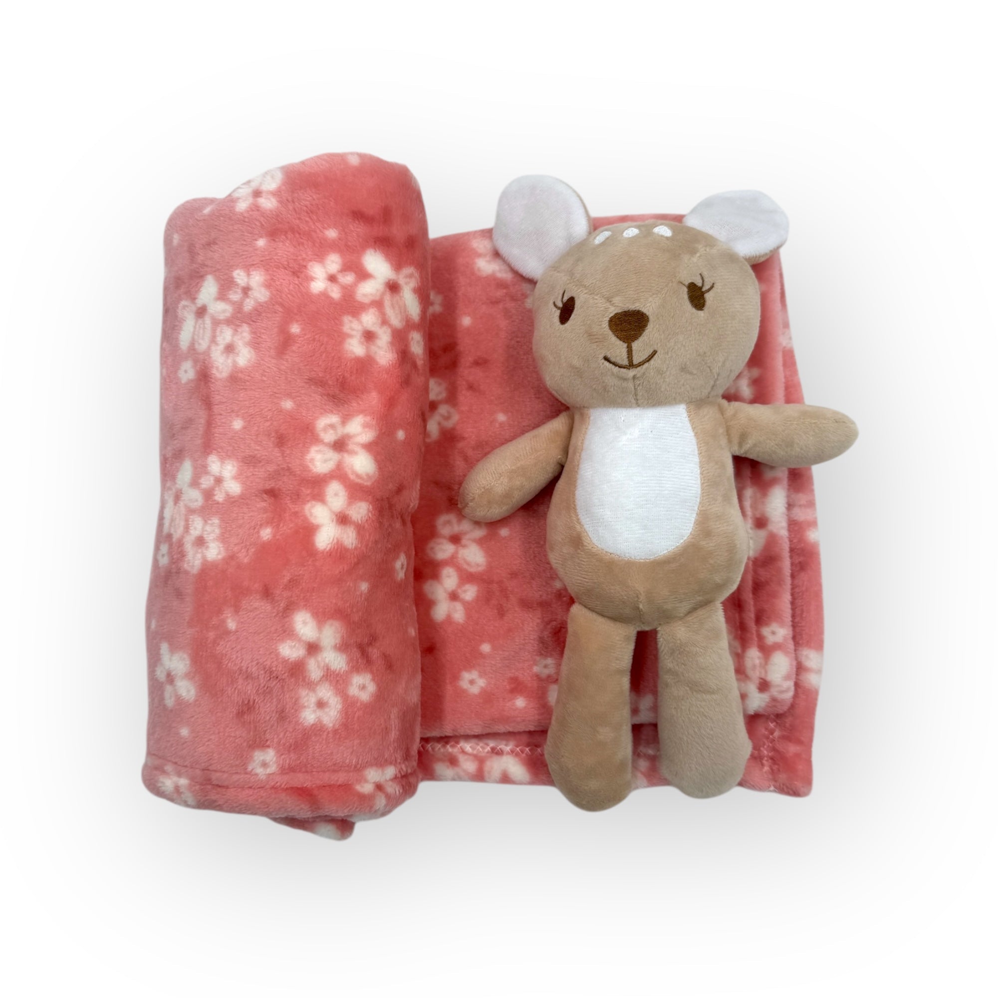 Plush toy bear with a pink floral blanket on a white background