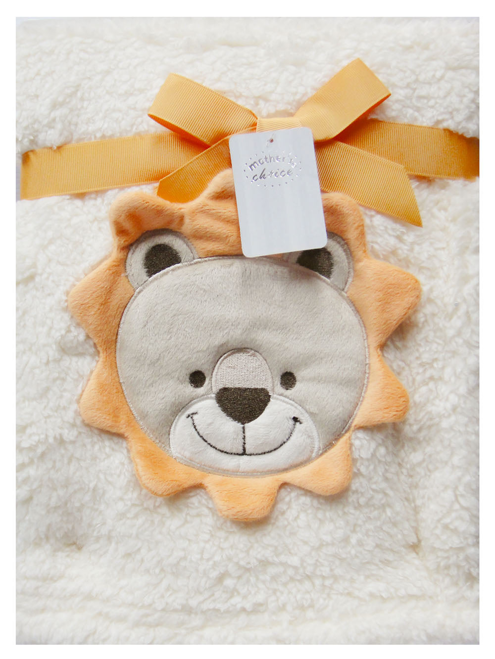 Plush lion toy with a yellow ribbon on a soft white background