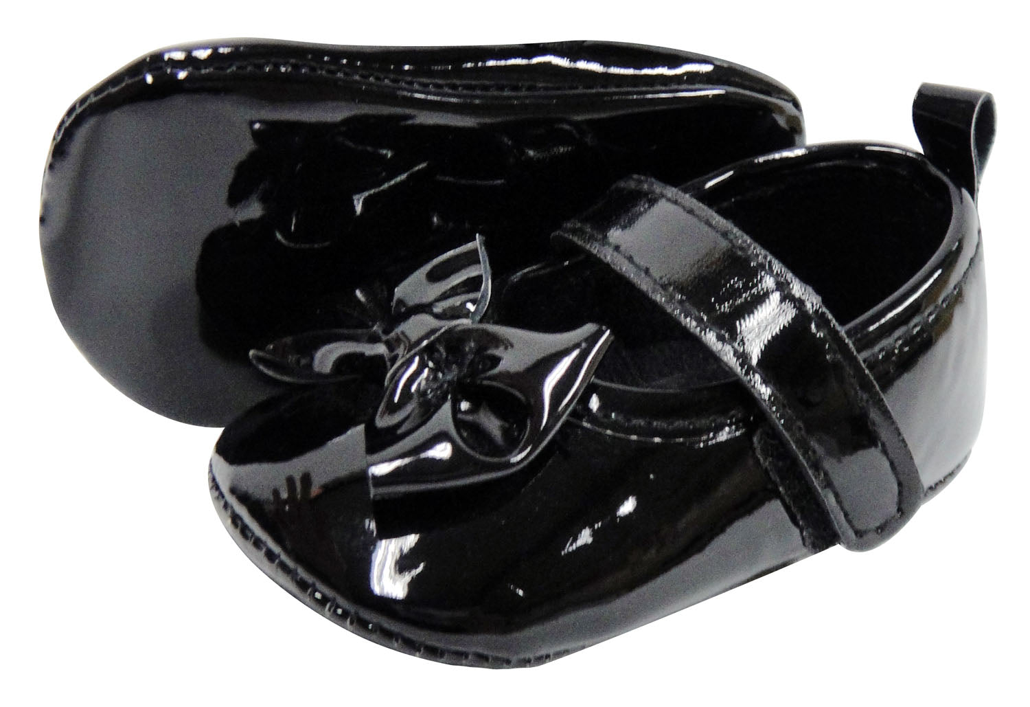 Black patent leather shoe with a decorative buckle on a white background