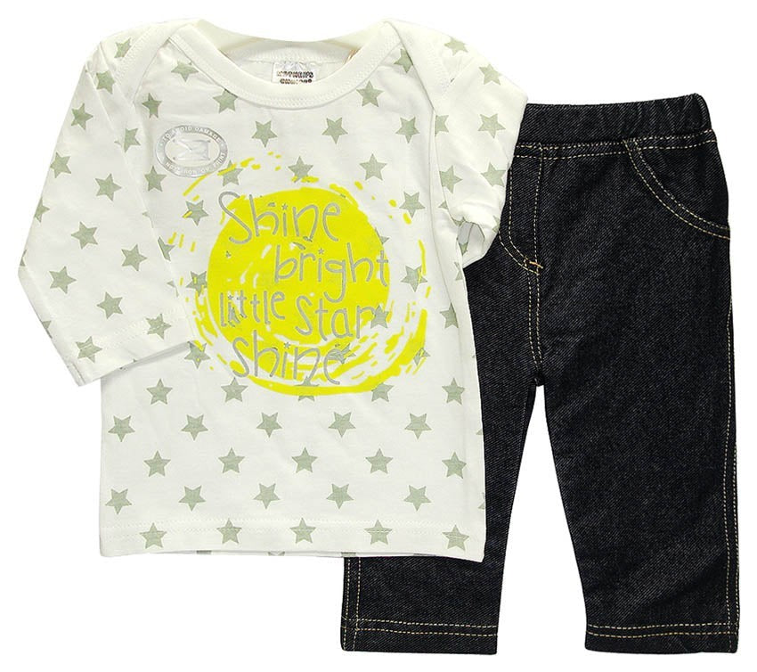 Children's outfit with star-patterned shirt and dark jeans on a white background