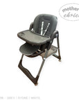 Gray high chair with tray on a white background, branded 'Mother's Choice'.