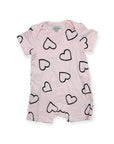 Pink baby romper with black heart patterns on a white background