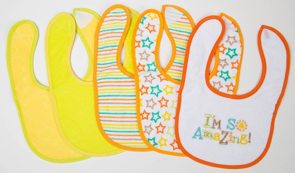 Set of colorful baby bibs with different designs on a white background