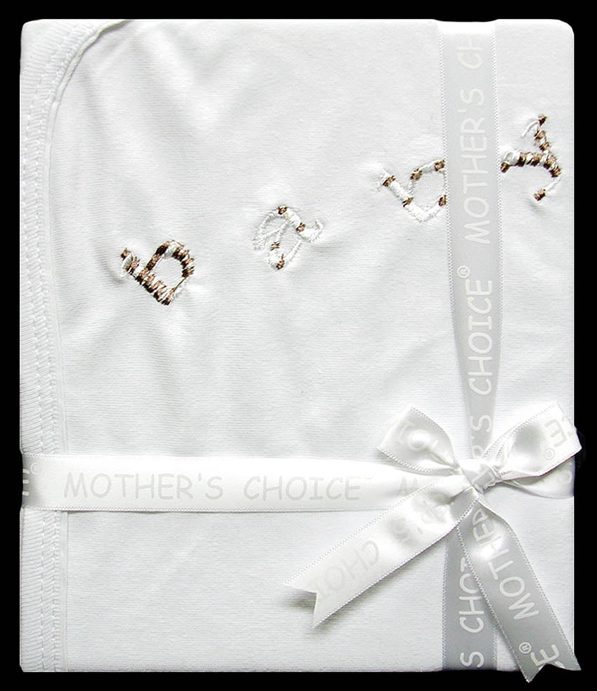 White baby blanket with 'Mother's Choice' branding and decorative elements on a black background