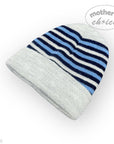 Knitted beanie with blue and navy stripes on a white background