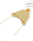 Yellow knit baby hat with a pom-pom on a white background, branded 'Mother's Choice'.