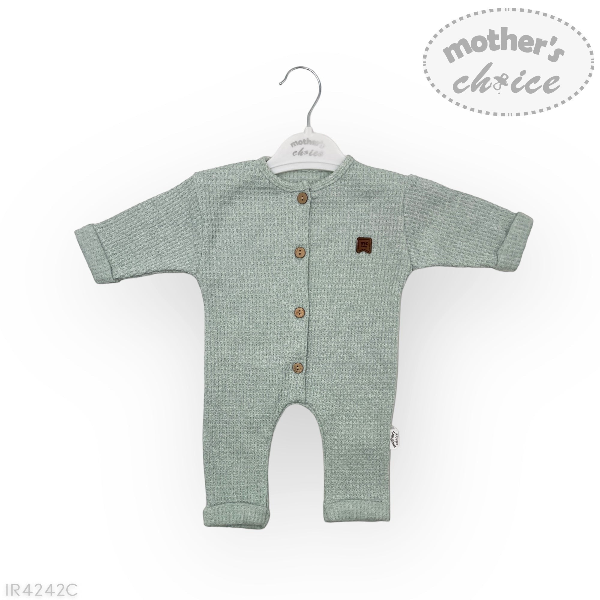 Green baby romper with brown buttons on a white background, featuring 'mother's choice' branding.