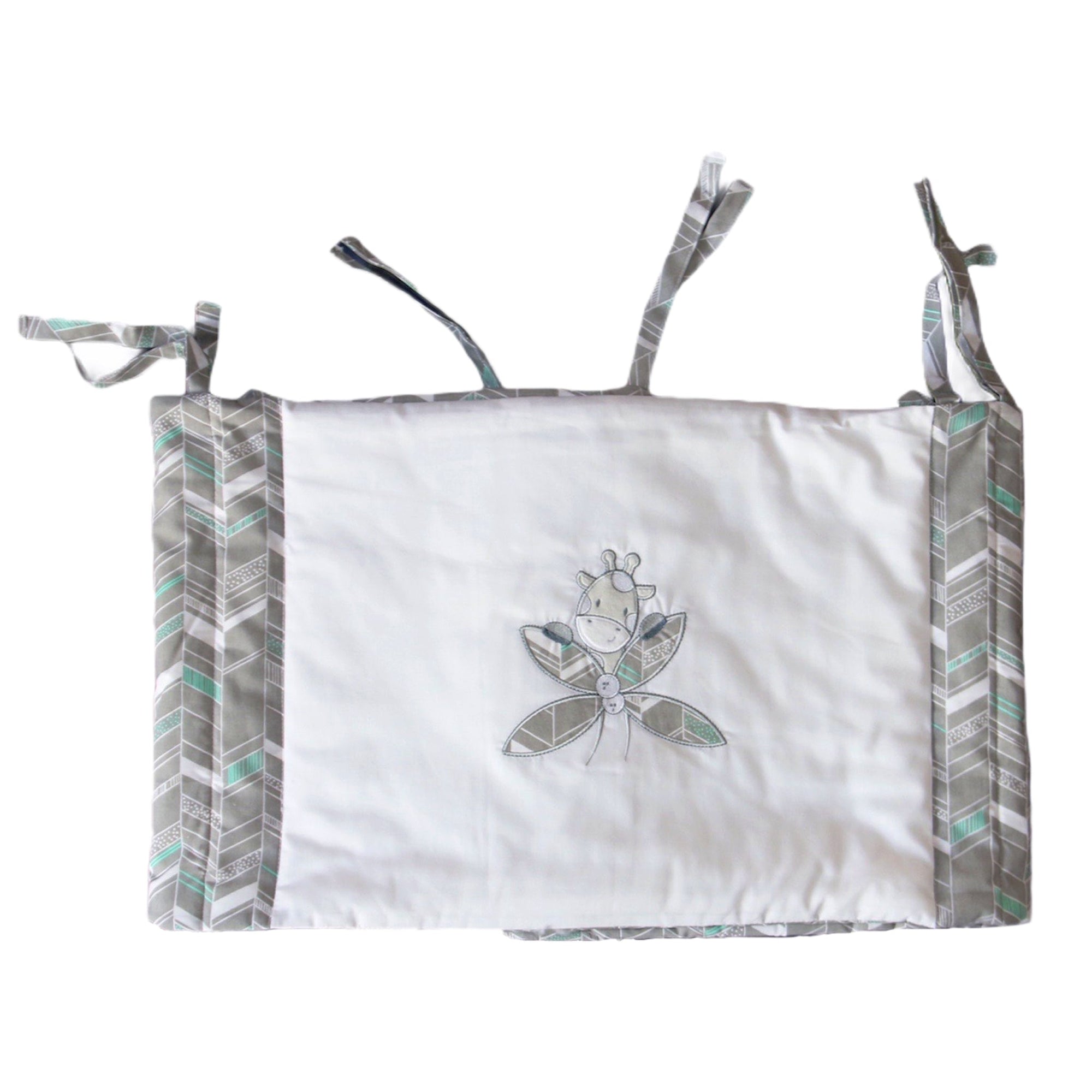 Baby crib bumper with dragonfly design on a white background