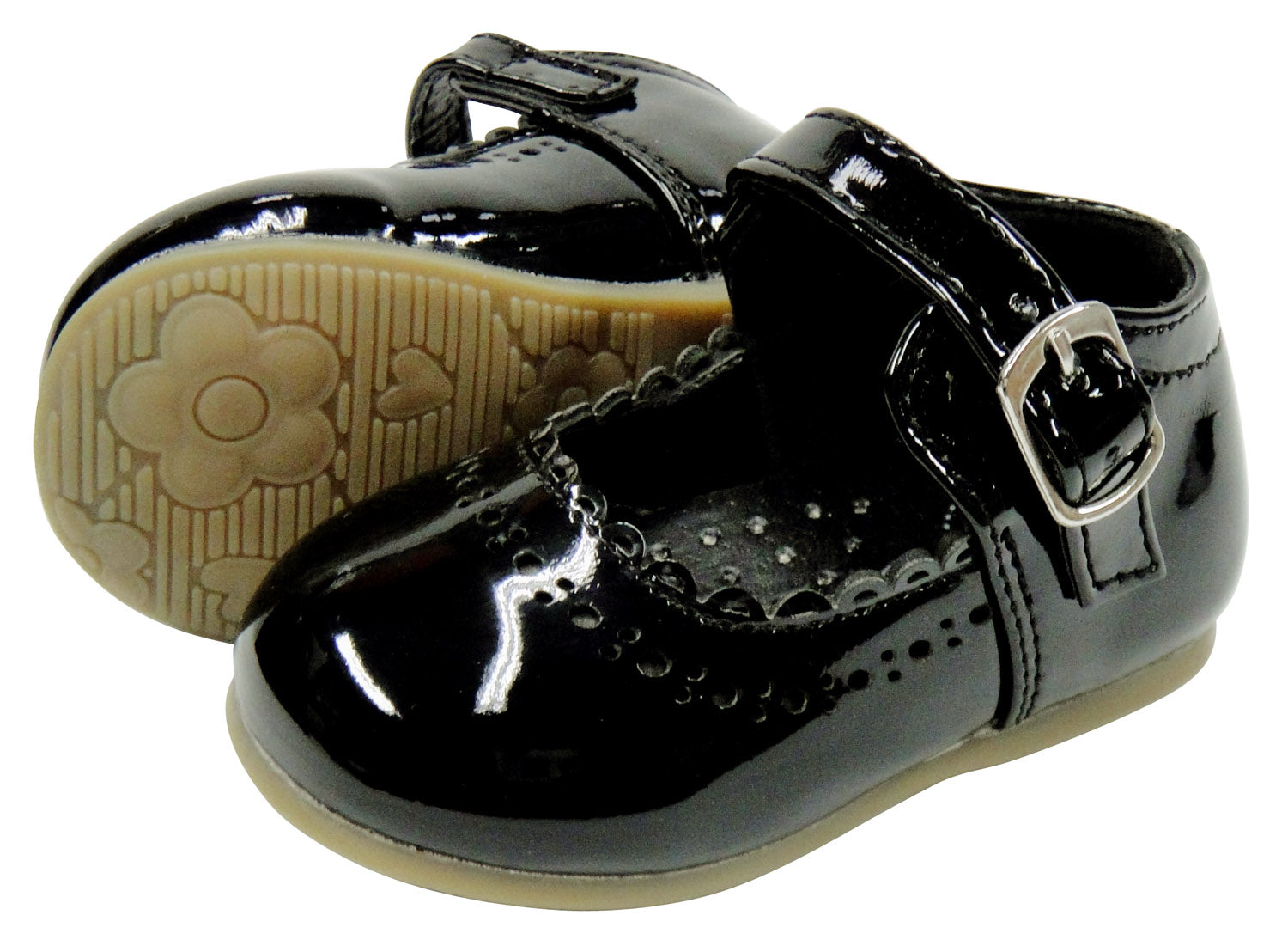 Black patent leather shoes with buckles on a white background