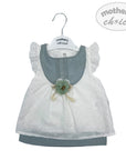 Baby dress with floral details on a 'mother's choice' hanger against a white background