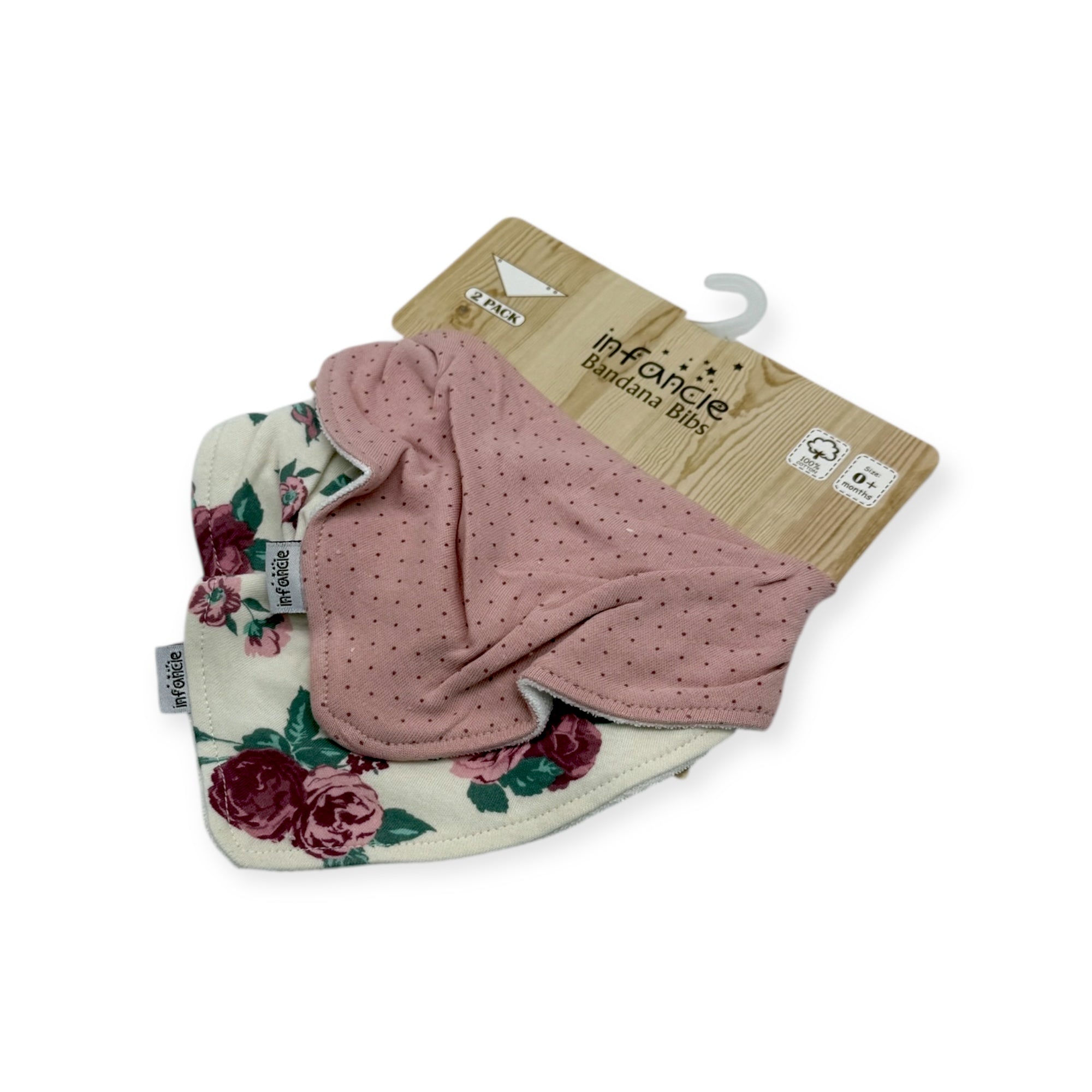 Two baby bibs, one floral and one pink with dots, on a white background.
