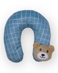 Blue checkered neck pillow with a bear face on a white background