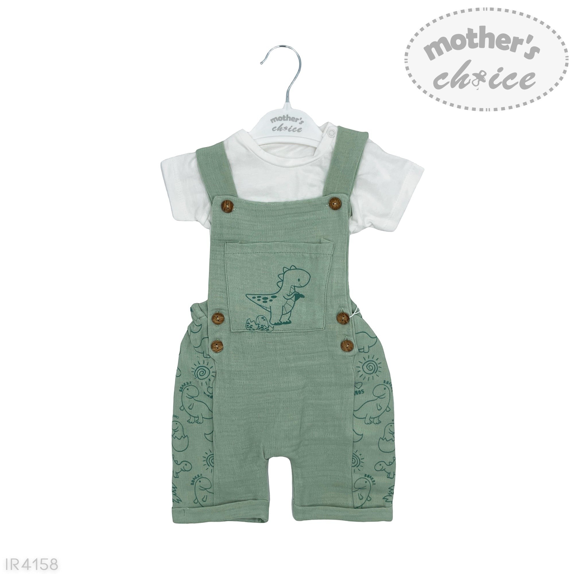 Green dino-themed overalls with a white shirt on a hanger, branded 'Mother's Choice'.