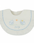 White baby bib with embroidered designs on a white background