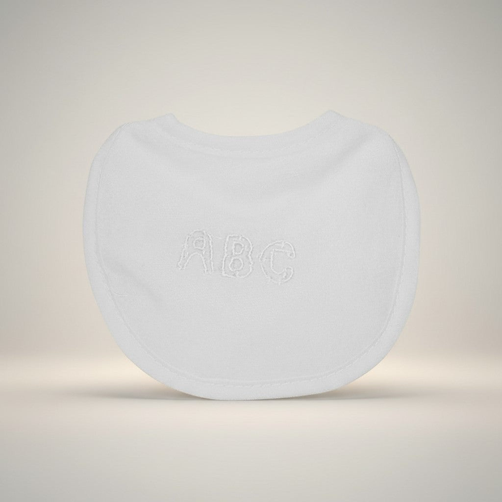 White spherical object with 'ABC' embossed on it against a light background