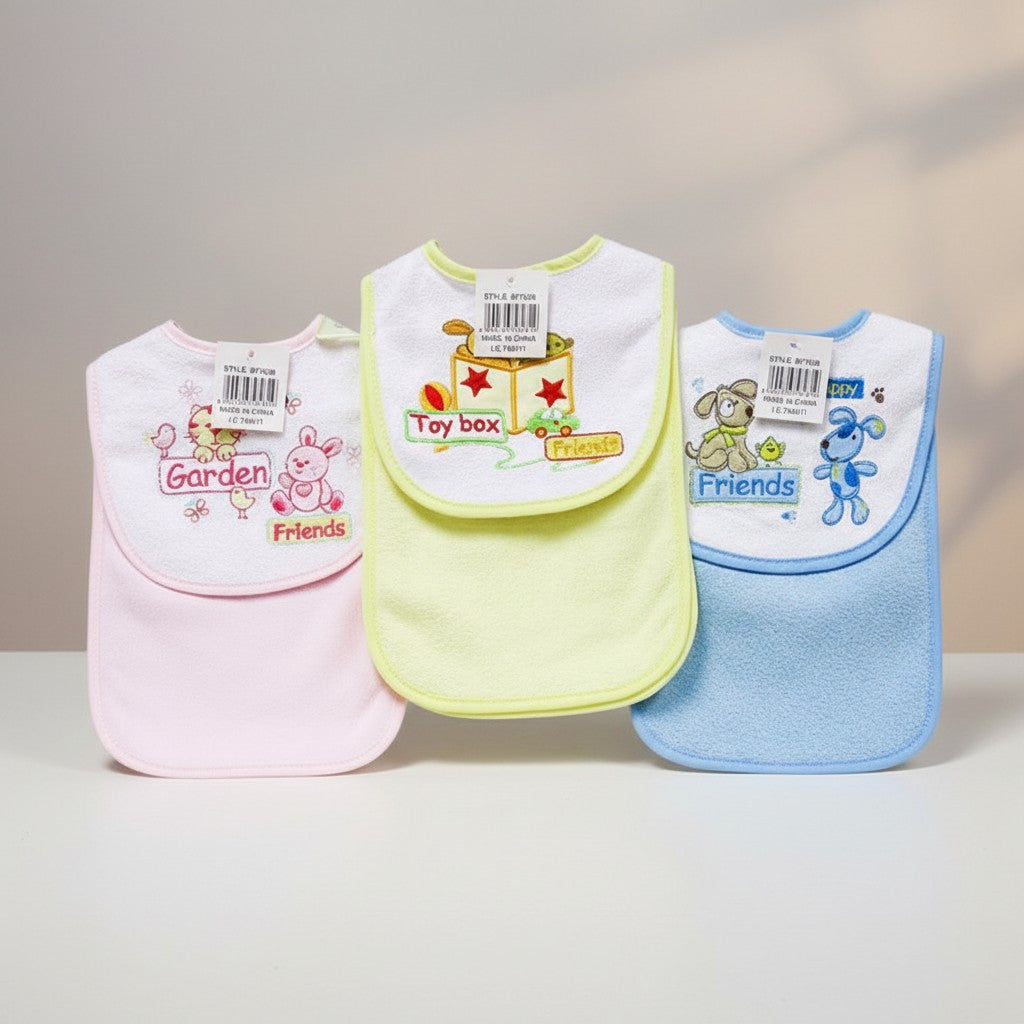 Three colorful baby bibs with cartoon designs on a neutral background